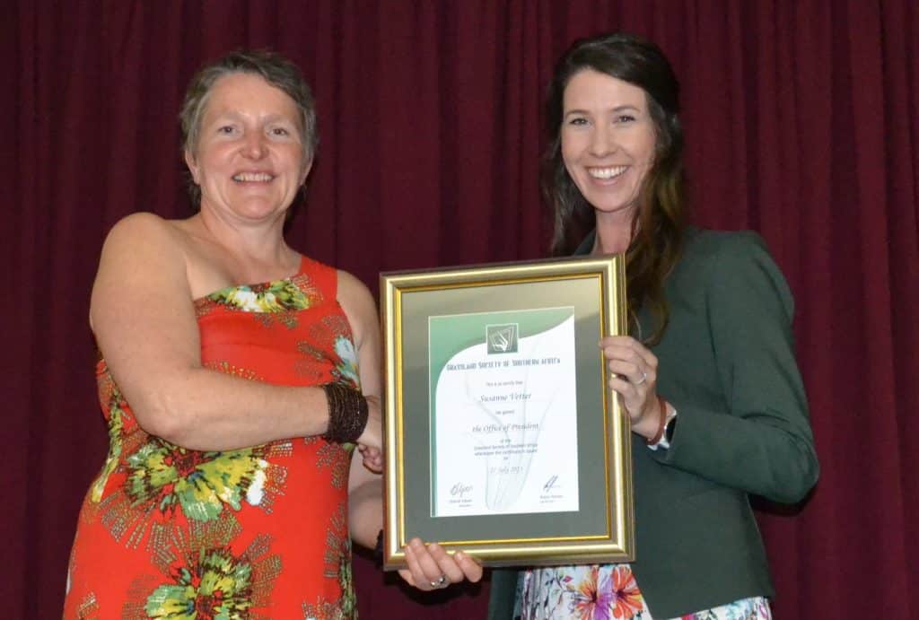 Prof Susi Vetter (left), an associate professor at Rhodes University’s Department of Botany, was elected as the new president of the Grassland Society of Southern Africa (GSSA). Here she is congratulated by Charné Viljoen, the outgoing president of the GSSA. (Photograph: Susan Marais)
