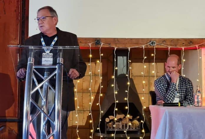 Dr Peter Evans, CEO of SAPPO. Seated behind him is Stephen Butt, outgoing chairperson of SAPPO.